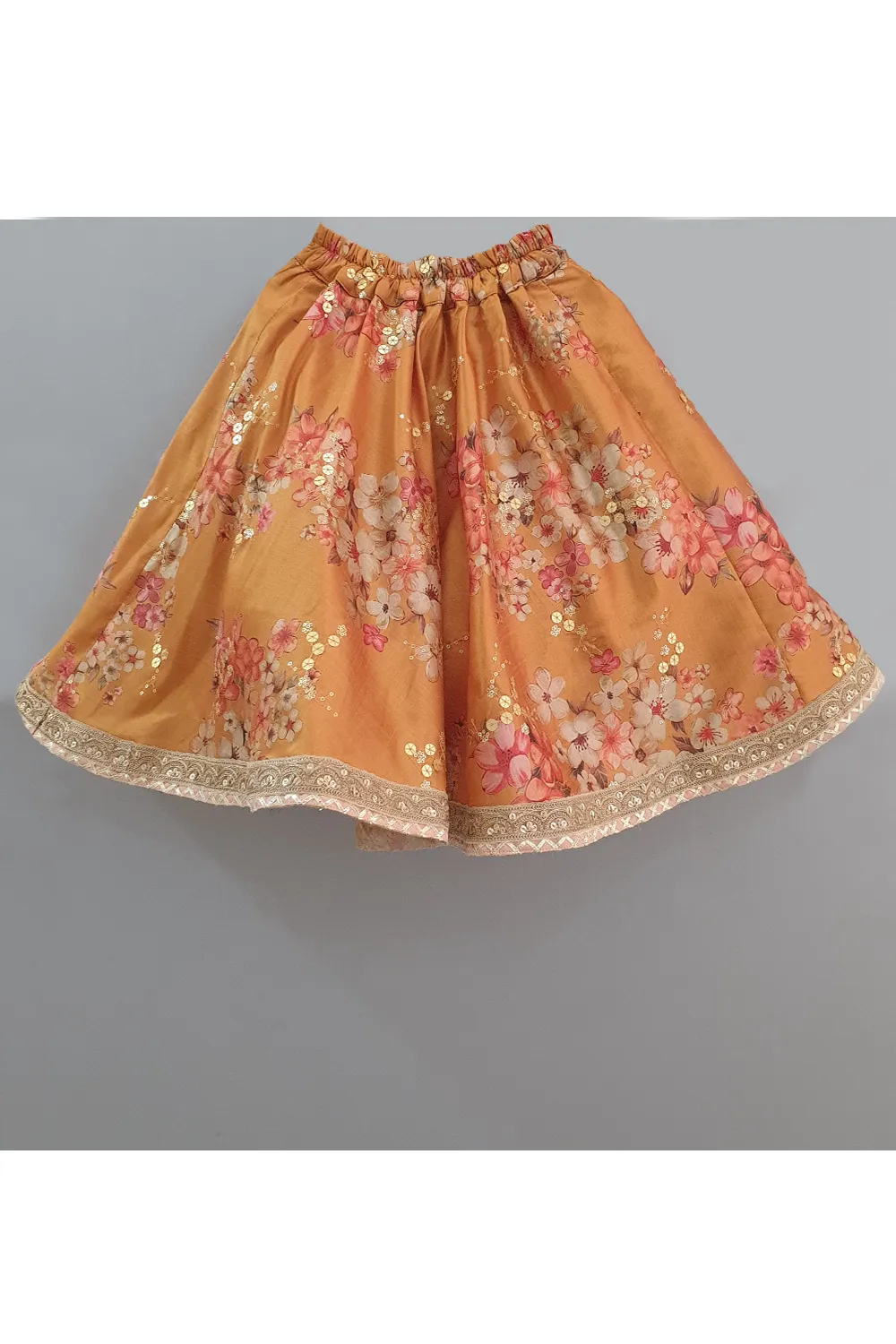 Golden beige top with attached dupatta and mustard floral lehenga